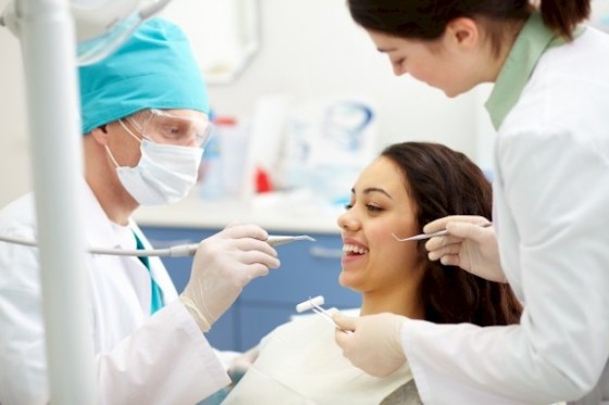 dentist-examining-a-patient-s-teeth_1098-568-608x0-is